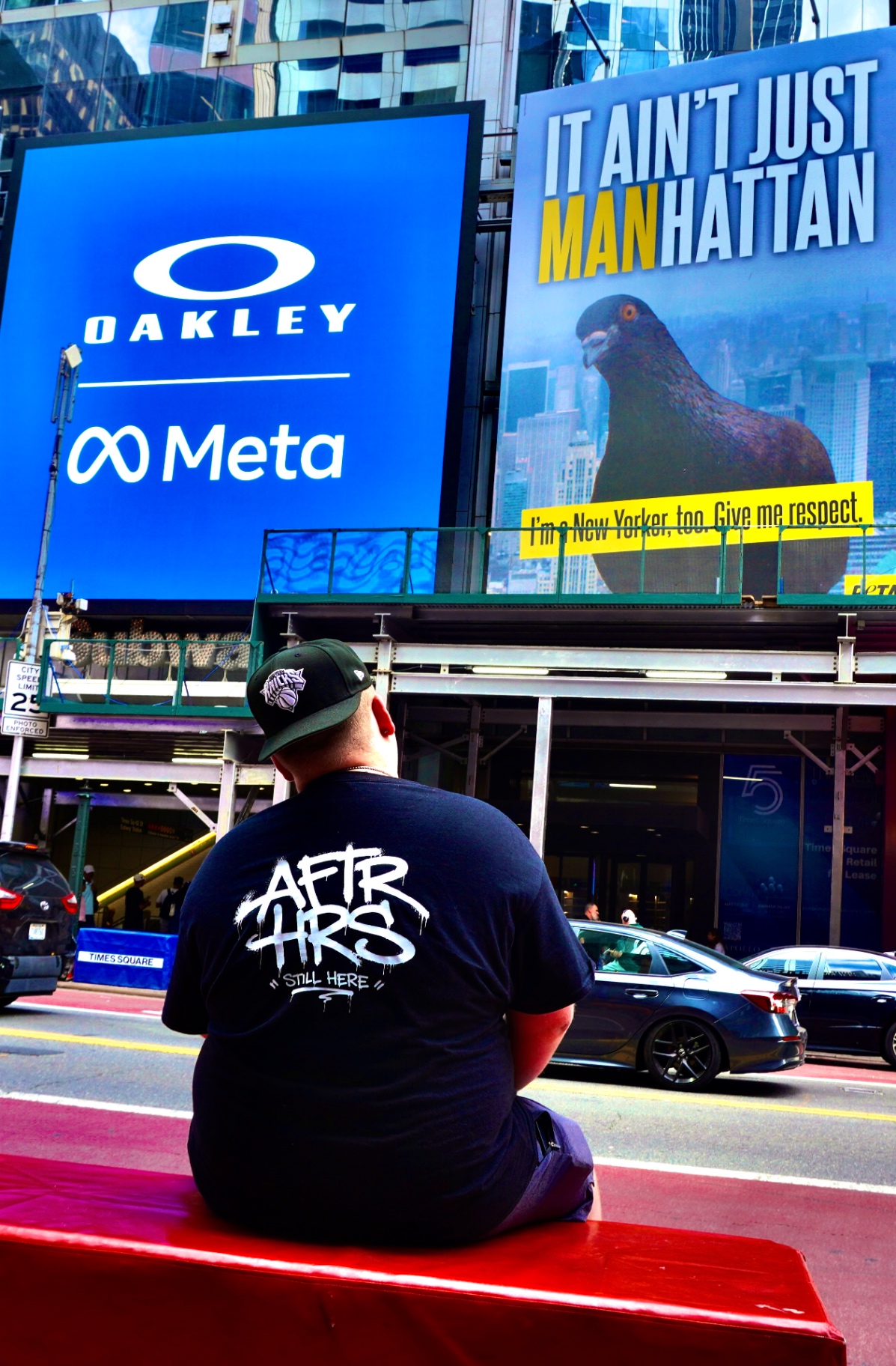 Co-founder of AFTR HRS NETWORK wearing the Still Here tee in Times Square